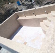 Terrazzo finished infinity swimming pool overlooking the landscape in Ngong