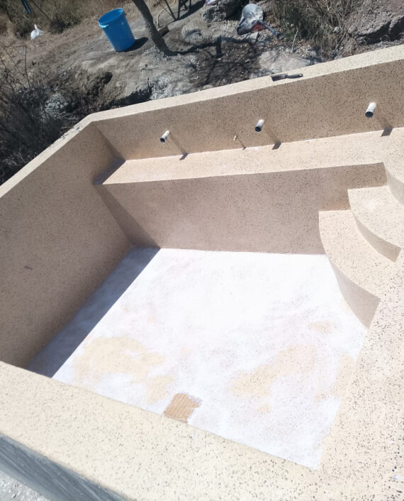 Terrazzo finished infinity swimming pool overlooking the landscape in Ngong
